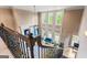 A view of the foyer with a fireplace, a sofa and large windows overlooking the backyard at 719 Bethpage Dr, Mcdonough, GA 30253