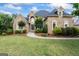 Charming brick home with manicured lawn, lush landscaping, and inviting curb appeal at 719 Bethpage Dr, Mcdonough, GA 30253