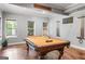 Finished basement game room features a pool table, stained concrete floors and recessed lighting at 719 Bethpage Dr, Mcdonough, GA 30253