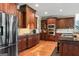 Well-equipped kitchen with stainless steel appliances, dark wood cabinets, and a central island with bar seating at 719 Bethpage Dr, Mcdonough, GA 30253