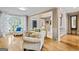 Bright and airy living room with hardwood floors and comfortable seating arrangement at 719 Bethpage Dr, Mcdonough, GA 30253