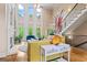 Spacious living room featuring fireplace, soaring windows, and a staircase at 719 Bethpage Dr, Mcdonough, GA 30253