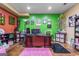 Home office with pink rug, creative decor, and a spacious layout that is perfect for productivity at 719 Bethpage Dr, Mcdonough, GA 30253