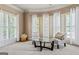 Cozy seating area with natural light provided by multiple windows at 719 Bethpage Dr, Mcdonough, GA 30253