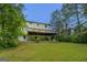 Exterior view of home with deck and lush green yard at 1201 Justin Ln, Lithonia, GA 30058