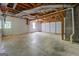 Unfinished basement with large garage door at 1201 Justin Ln, Lithonia, GA 30058