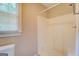Bright bathroom featuring a white shower and a window at 1201 Justin Ln, Lithonia, GA 30058