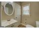 Well-lit bathroom features a vanity sink, mirror and a toilet at 1201 Justin Ln, Lithonia, GA 30058
