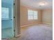 Spacious bedroom with two windows and a door at 1201 Justin Ln, Lithonia, GA 30058