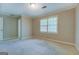 This bedroom is freshly carpeted with natural lighting at 1201 Justin Ln, Lithonia, GA 30058
