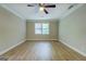 Bedroom featuring neutral walls, ceiling fan and a window at 1201 Justin Ln, Lithonia, GA 30058