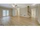 Open-concept living room with updated flooring, neutral tones, and seamless flow into other living spaces at 1201 Justin Ln, Lithonia, GA 30058