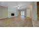 Spacious living room featuring a decorative fireplace, neutral tones, and updated flooring at 1201 Justin Ln, Lithonia, GA 30058