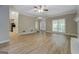 Bright and airy living room with updated flooring, neutral tones, and ample space for entertaining at 1201 Justin Ln, Lithonia, GA 30058