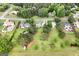 Aerial view of homes on large lots with mature trees in a suburban community at 235 Surrey Park Dr, Fayetteville, GA 30215