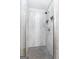 Bathroom featuring luxurious tiled shower with glass door and built-in shower niche at 235 Surrey Park Dr, Fayetteville, GA 30215