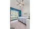 Bright bedroom with sloped ceiling, patterned curtains and plush carpet at 235 Surrey Park Dr, Fayetteville, GA 30215