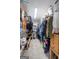 Walk-in closet provides ample storage with shelving and hanging racks for organization at 235 Surrey Park Dr, Fayetteville, GA 30215