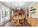 Inviting dining room with wood table, matching chairs, chandelier, and large window at 235 Surrey Park Dr, Fayetteville, GA 30215