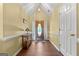 Elegant entryway featuring hardwood floors, a chandelier, and a decorative glass front door at 235 Surrey Park Dr, Fayetteville, GA 30215