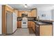 Functional kitchen featuring wooden cabinets, stainless steel appliances, and tile flooring at 235 Surrey Park Dr, Fayetteville, GA 30215