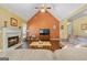 Warm living room featuring a fireplace, comfortable seating, and ample natural light, perfect for gatherings at 235 Surrey Park Dr, Fayetteville, GA 30215
