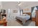 Spacious main bedroom with vaulted ceiling, neutral carpet, and ensuite bathroom access at 235 Surrey Park Dr, Fayetteville, GA 30215