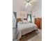 Serene main bedroom with neutral tones, carpet, and window views; ample natural light at 235 Surrey Park Dr, Fayetteville, GA 30215