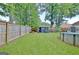 Expansive fenced backyard with well-maintained lawn, complete with an above-ground pool and utility shed at 170 Habersham Dr, Fayetteville, GA 30214