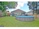 Lush, well-maintained backyard featuring an above-ground pool and small utility shed at 170 Habersham Dr, Fayetteville, GA 30214