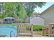 Backyard area featuring a well-maintained pool, a shed and lush greenery at 170 Habersham Dr, Fayetteville, GA 30214