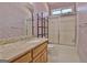 Bathroom with vanity, shower, and decorative wallpaper at 170 Habersham Dr, Fayetteville, GA 30214