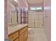 Bathroom with shower, vanity, and decorative wallpaper at 170 Habersham Dr, Fayetteville, GA 30214