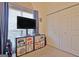 Bedroom with large window, closet, and toy storage at 170 Habersham Dr, Fayetteville, GA 30214