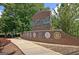 The Fayetteville entrance sign features brick, signage, and greenery at 170 Habersham Dr, Fayetteville, GA 30214