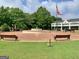 Picturesque town center with a fountain, benches, and a view of the Georgia and US flags at 170 Habersham Dr, Fayetteville, GA 30214