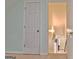 This hallway reveals a view down the stairs, with natural light coming from the windows at 170 Habersham Dr, Fayetteville, GA 30214