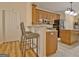 This kitchen is enhanced by a breakfast bar with elegant counter stools and upgraded stainless steel appliances at 170 Habersham Dr, Fayetteville, GA 30214