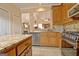 Spacious kitchen boasts custom cabinets, stainless steel appliances, granite countertops, and tiled backsplash at 170 Habersham Dr, Fayetteville, GA 30214