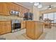 Modern kitchen featuring stainless steel appliances, center island, and adjacent dining area at 170 Habersham Dr, Fayetteville, GA 30214