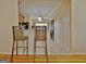 Open-concept kitchen featuring stainless steel appliances, granite countertops, and an adjacent breakfast bar at 170 Habersham Dr, Fayetteville, GA 30214