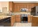 Spacious kitchen featuring granite countertops and stainless steel appliances at 170 Habersham Dr, Fayetteville, GA 30214