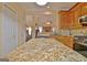 Gourmet kitchen featuring granite countertops and an open layout into the living space at 170 Habersham Dr, Fayetteville, GA 30214