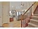 Spacious living room features a cozy fireplace and staircase at 170 Habersham Dr, Fayetteville, GA 30214