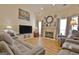 Inviting living room with a cozy fireplace and comfortable seating arrangement at 170 Habersham Dr, Fayetteville, GA 30214