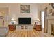 Charming living room with a large television and decorative accents at 170 Habersham Dr, Fayetteville, GA 30214