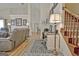 Bright living area featuring a home office space, stairs, and comfortable seating at 170 Habersham Dr, Fayetteville, GA 30214