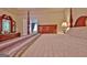 Comfortable primary bedroom with a well-made bed, classic wood accents, and a view of the backyard at 170 Habersham Dr, Fayetteville, GA 30214