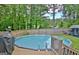 This property features a well-maintained pool, deck, surrounded by lush greenery, offering privacy and relaxation at 170 Habersham Dr, Fayetteville, GA 30214
