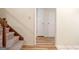 Carpeted stairs and wood railing leading to open doorways at 170 Habersham Dr, Fayetteville, GA 30214